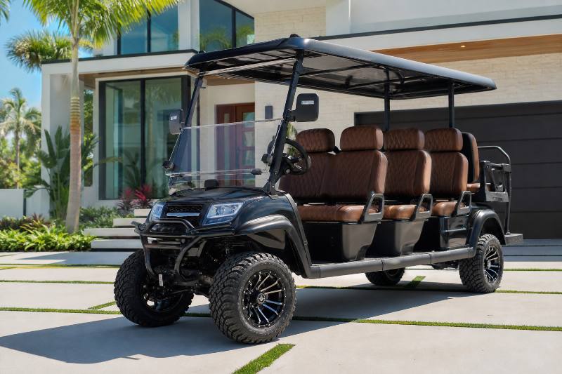A custom 6-passenger golf car, gas-powered, with lifted suspension and off-road tires, navigating a scenic, well-maintained trail with a group of friends enjoying the ride.